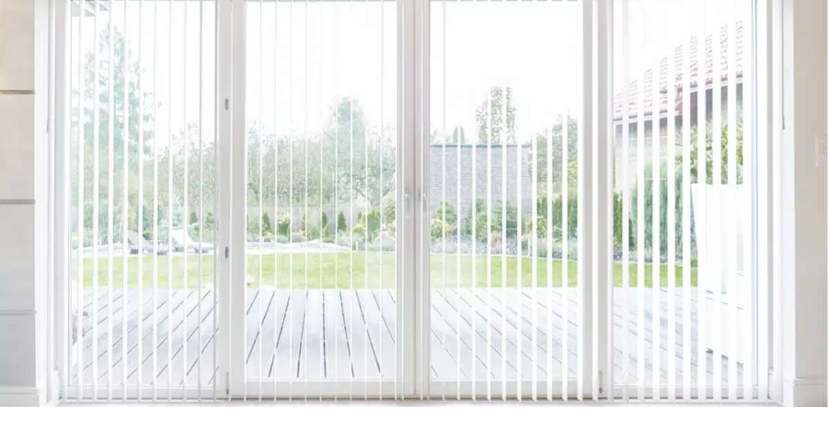 Contemporary home decor showcasing panel track blinds against wide windows.