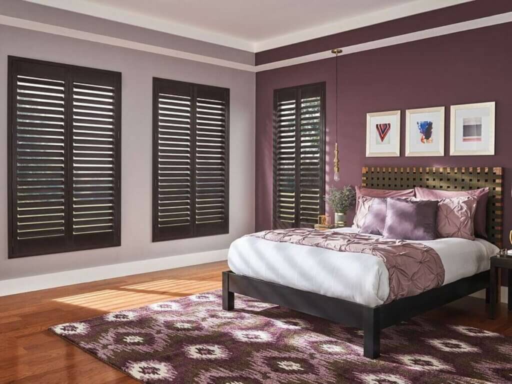 Wood shutters are crafted from natural wood, offering a classic, luxurious appeal.